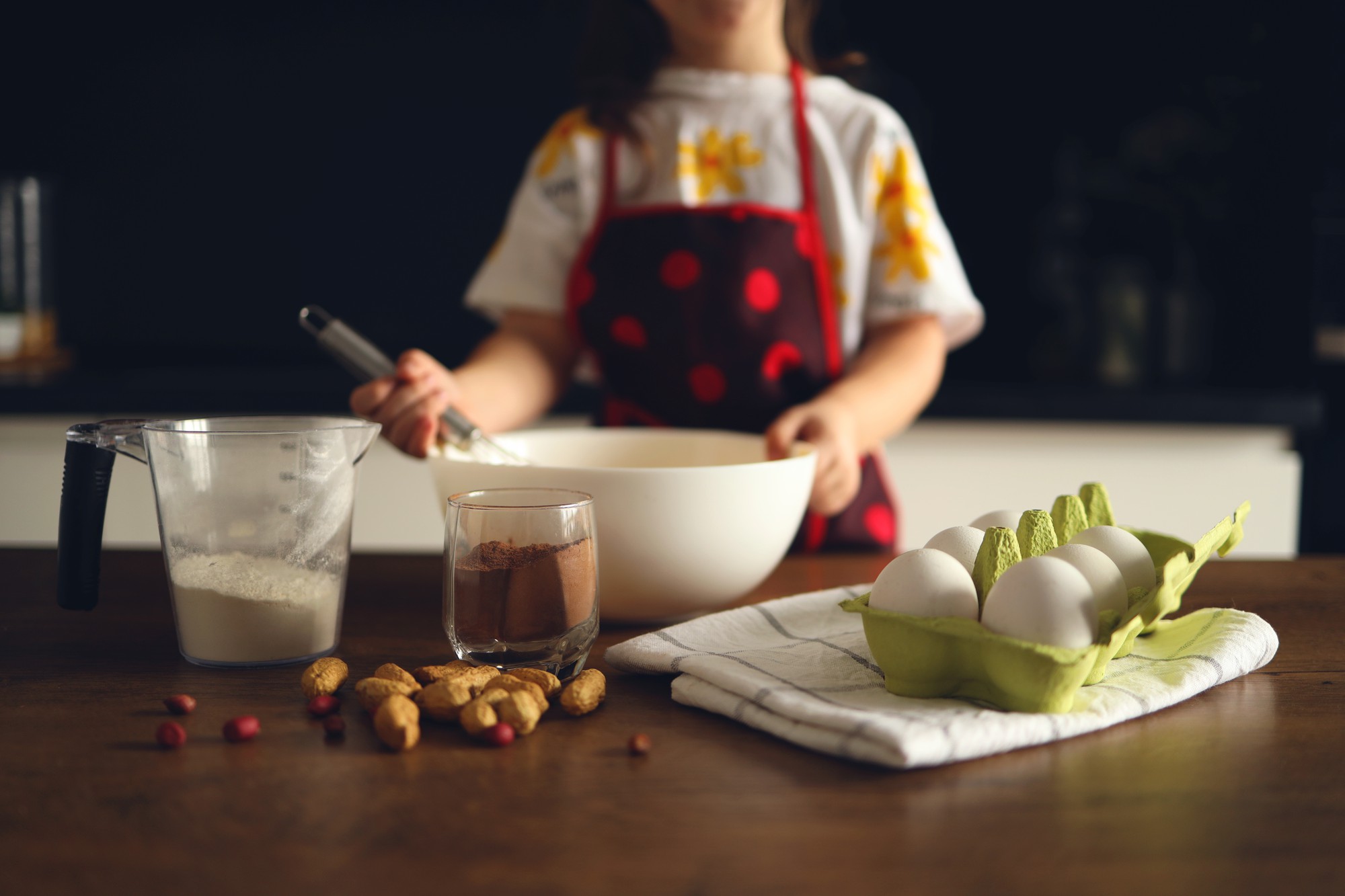 Studio kitchen with chef and countertop ingredients